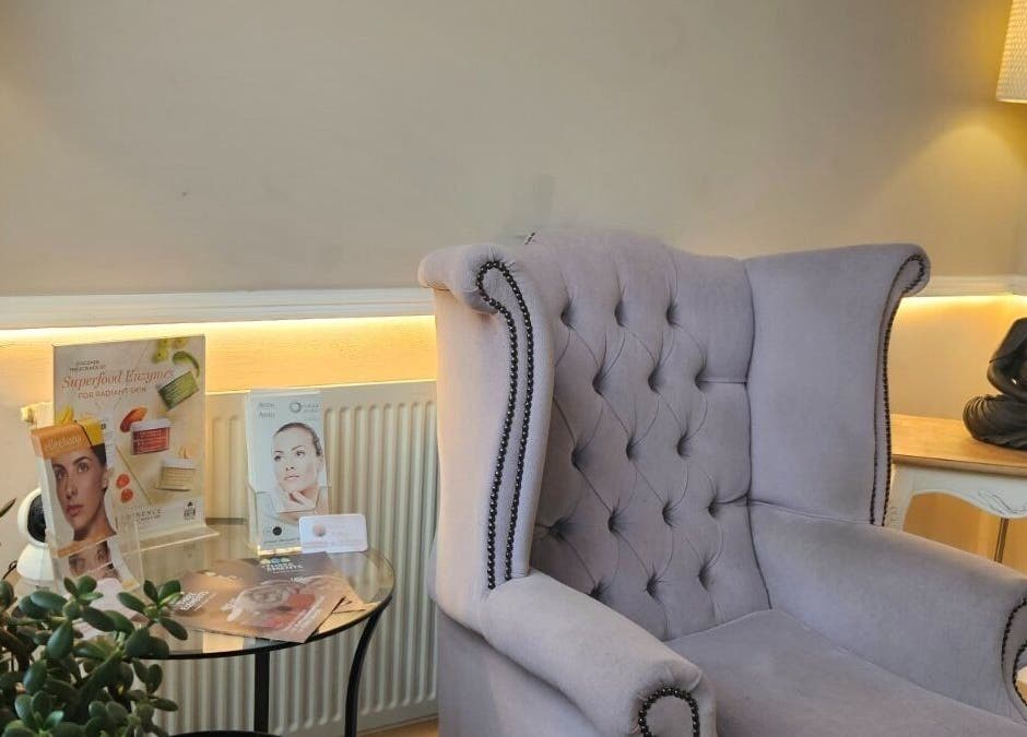 Elegant seating area in Elle Aesthetic, London, England. Features a plush armchair and decor enhancing relaxation.