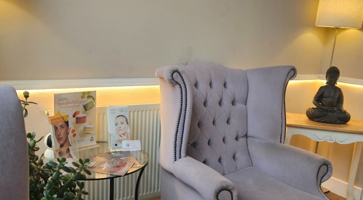 Elegant seating area in Elle Aesthetic, London, England. Features a plush armchair and decor enhancing relaxation.