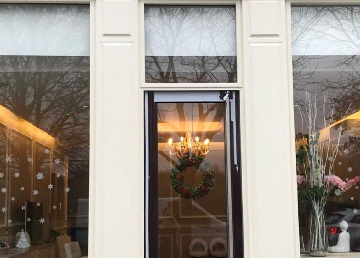 Exterior of Elle Aesthetic in London, England, GB with elegant decor and wreath on the door.