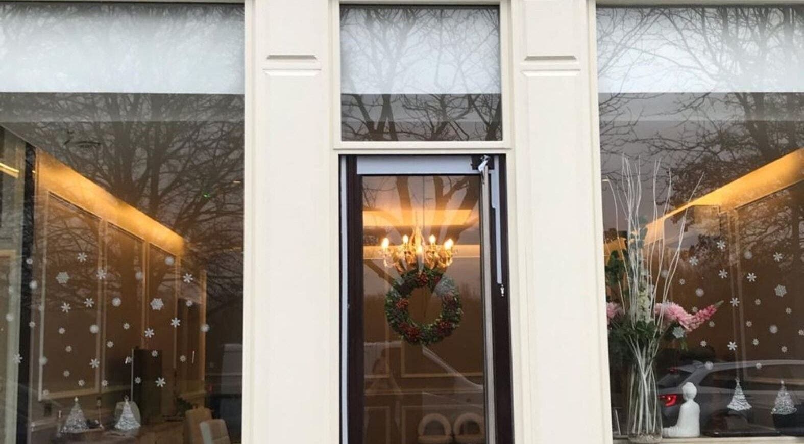 Exterior of Elle Aesthetic in London, England, GB with elegant decor and wreath on the door.