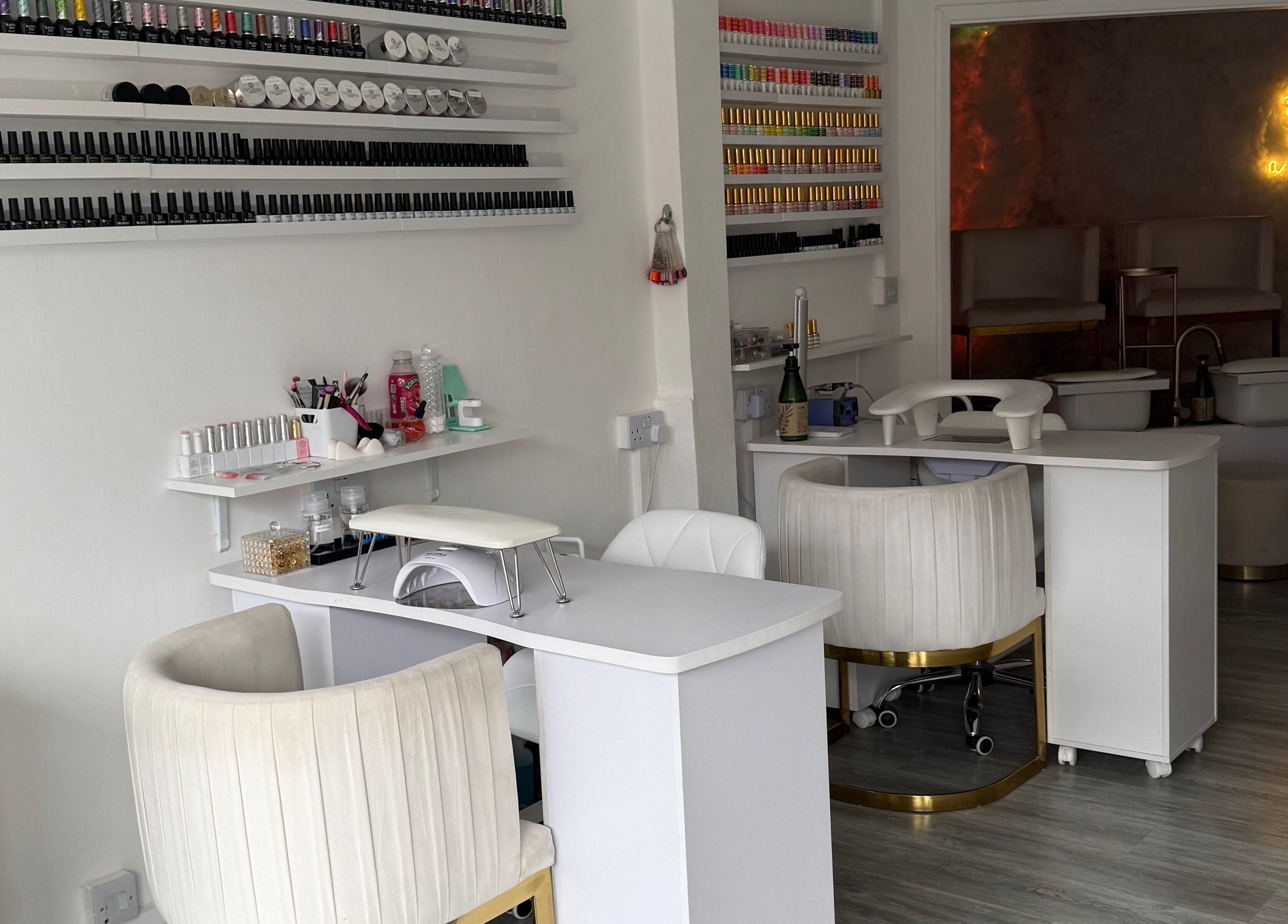 Elegant nail salon at The Studio UK, Southend-on-sea, England, GB with modern manicure stations and polished ambiance.