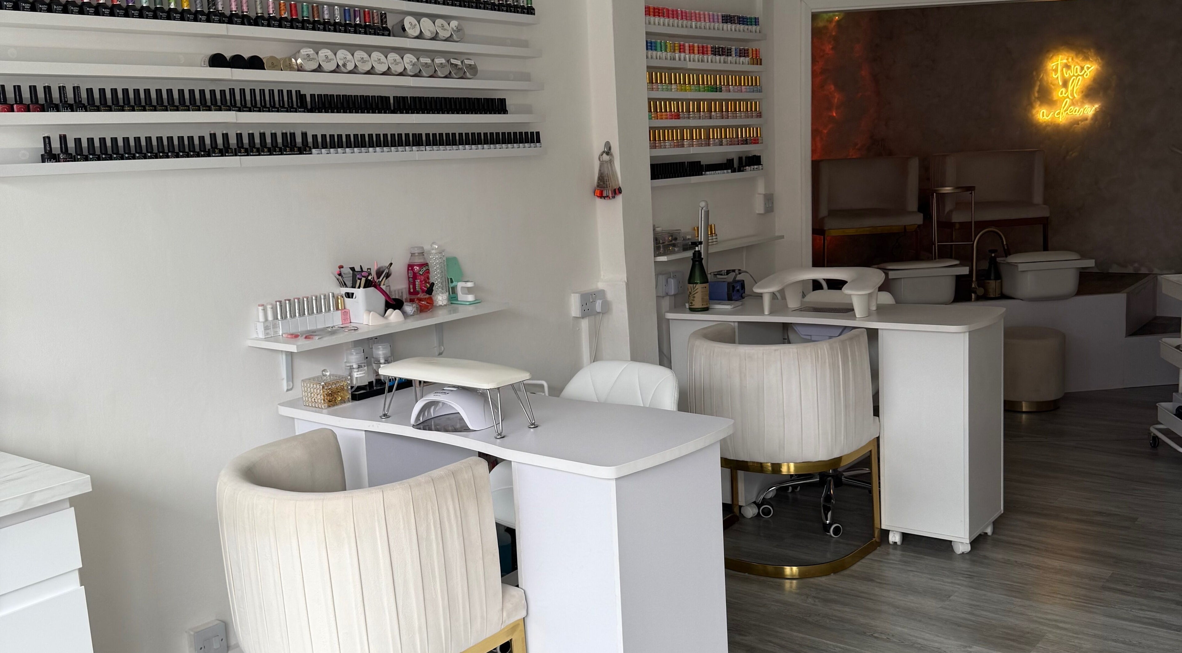 Elegant nail salon at The Studio UK, Southend-on-sea, England, GB with modern manicure stations and polished ambiance.