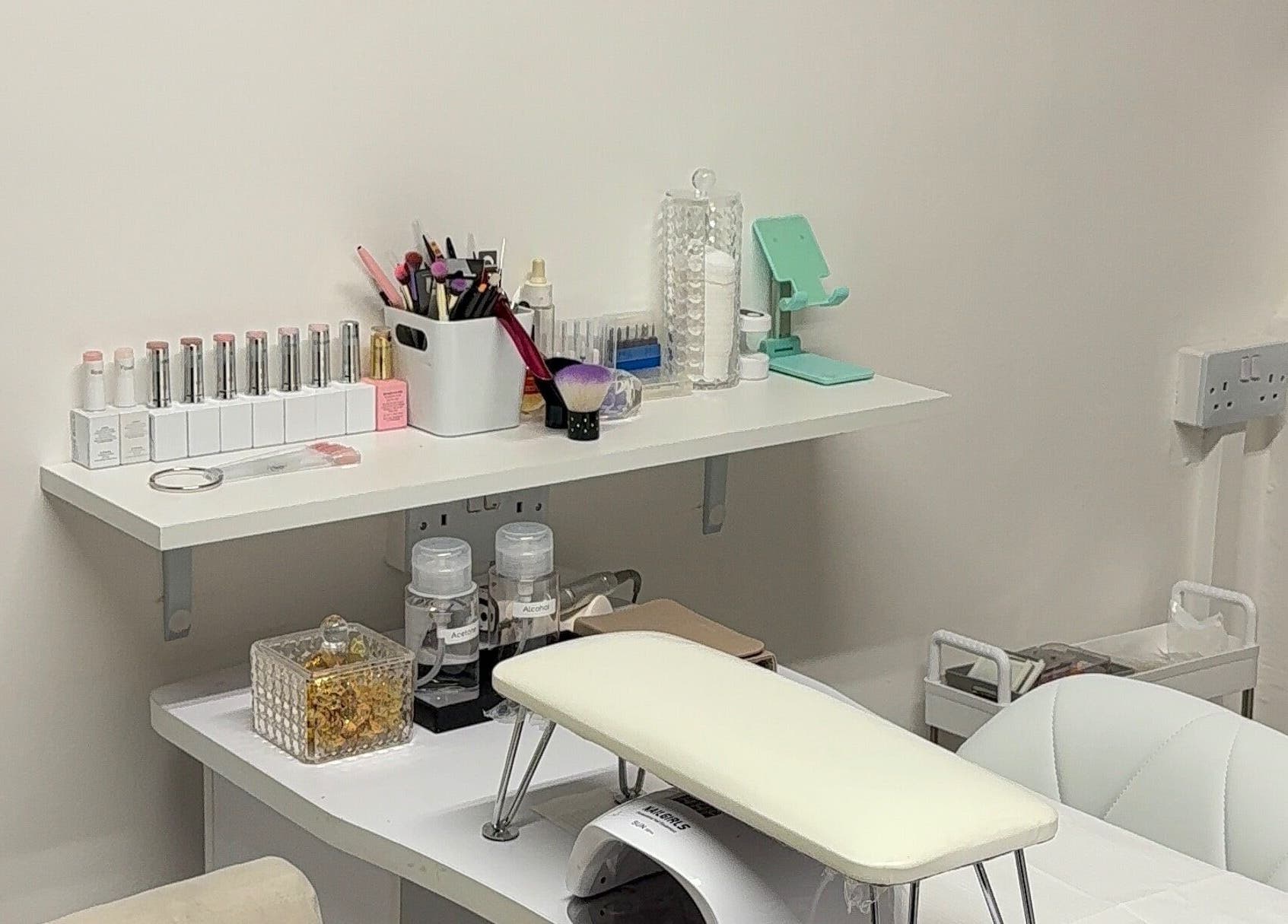 Nail care station at The Studio UK, Southend-on-sea, England, GB, featuring organized nail products and tools.
