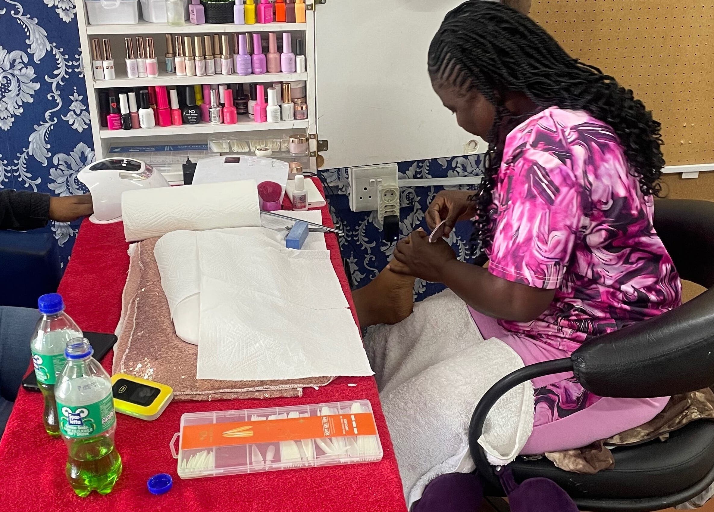 Professional nail care at Angela’s Nail Bar in Midrand, Gauteng, ZA, featuring a cozy manicure setup.