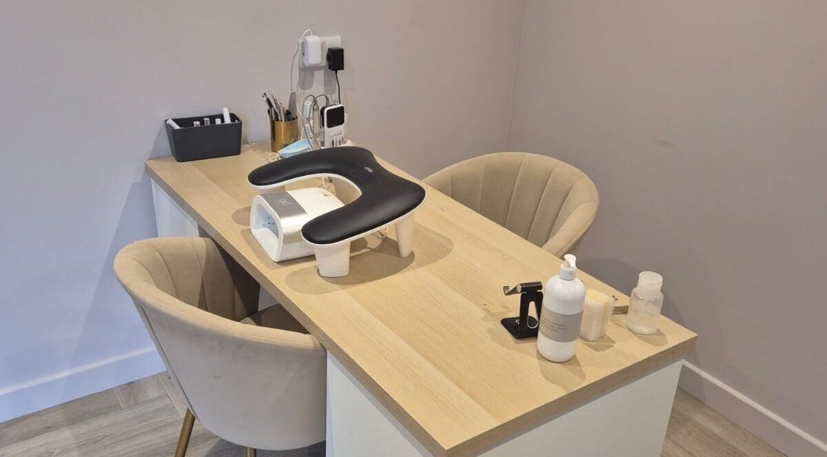 Nail salon workspace at By Kelsx in Langley, England, GB, featuring manicure tools and elegant seating.