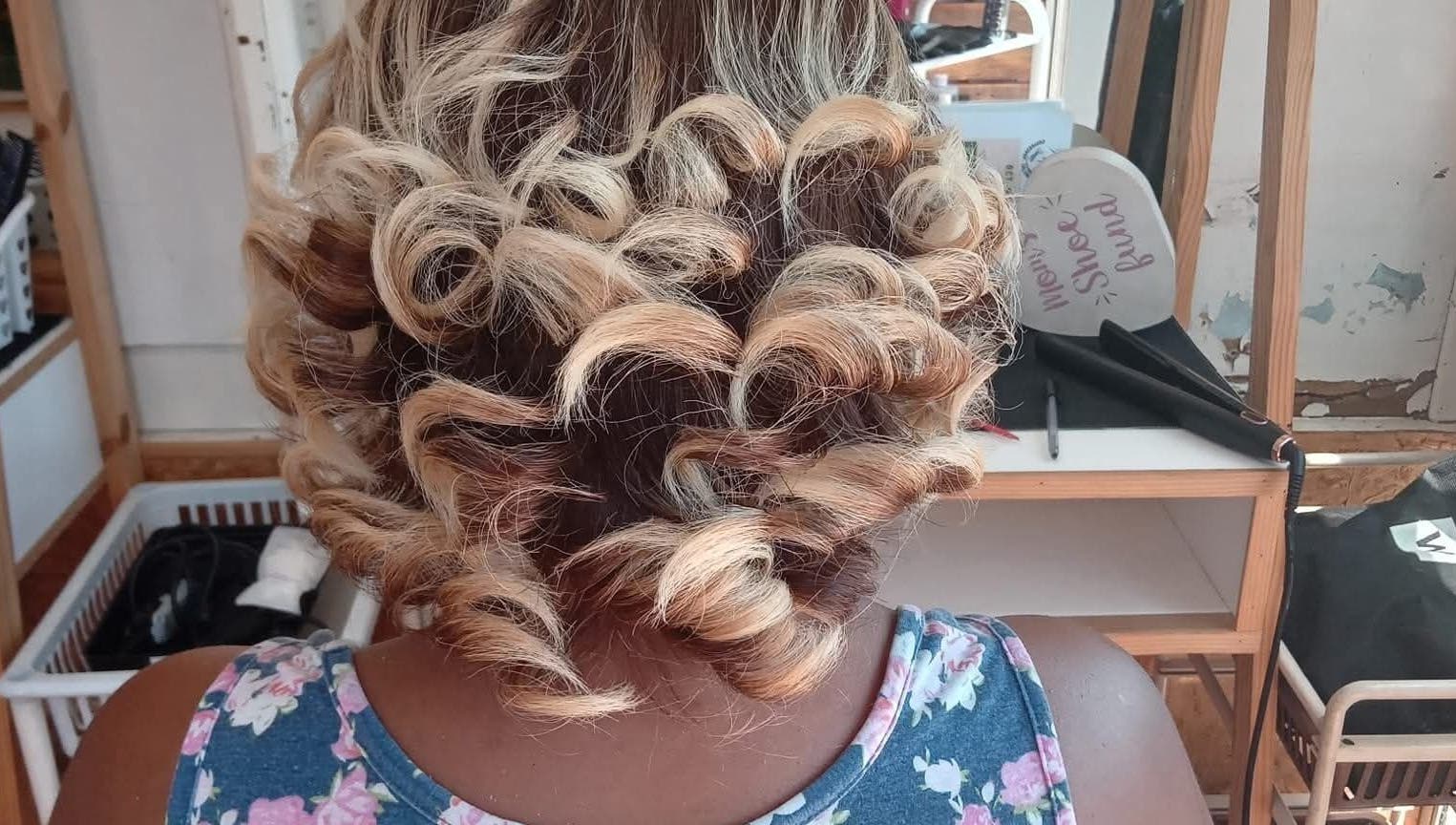 Elegant blonde curls styled at Antwaan Hair Studio 82 in Cape Town, Western Cape, ZA.