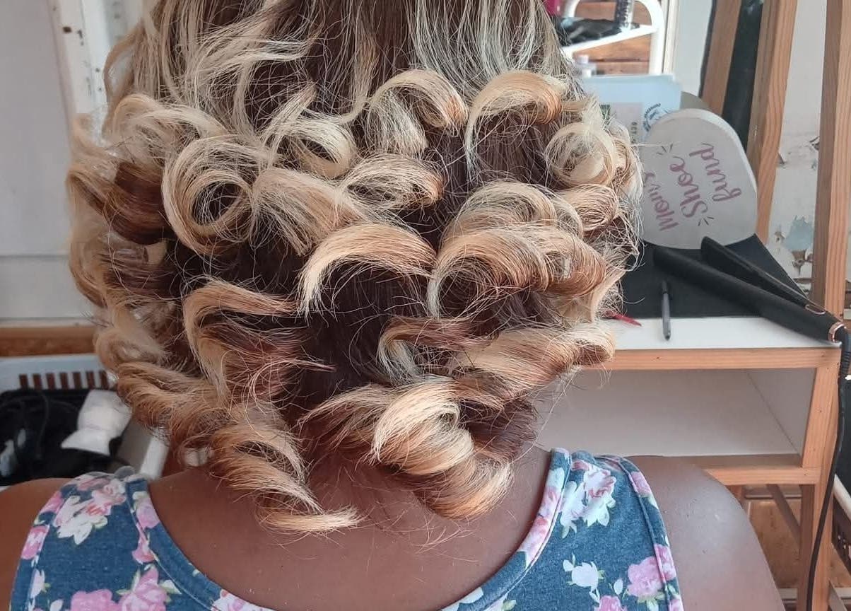 Elegant blonde curls styled at Antwaan Hair Studio 82 in Cape Town, Western Cape, ZA.