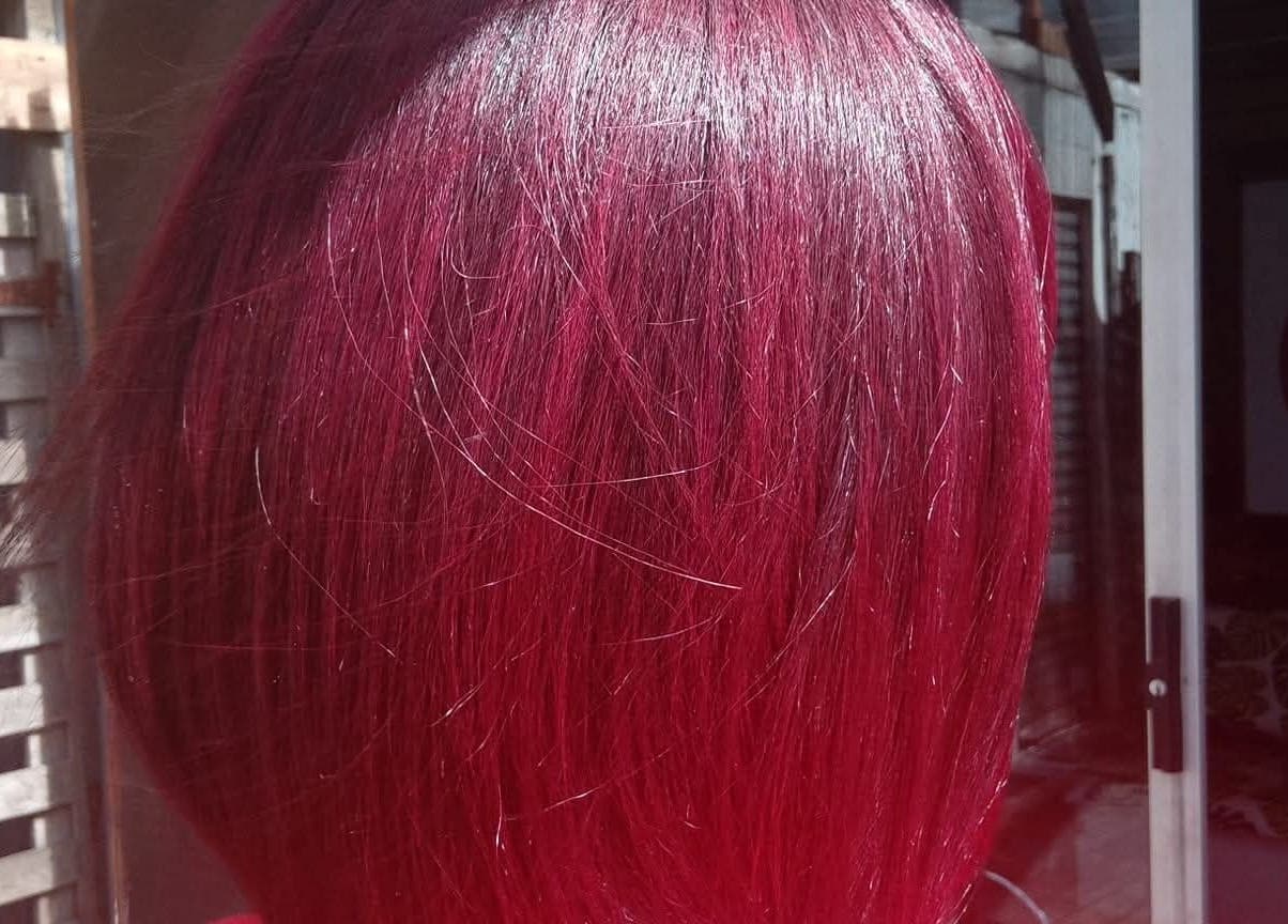 Elegant vibrant red hairstyle showcased at Antwaan Hair Studio 82, Cape Town, Western Cape, ZA.