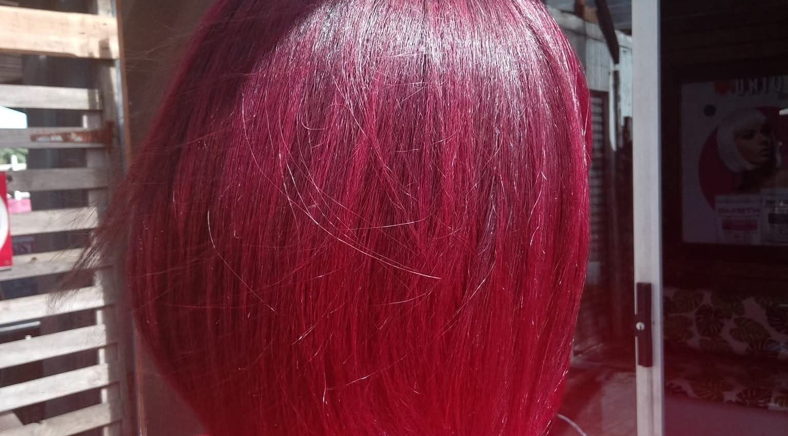Elegant vibrant red hairstyle showcased at Antwaan Hair Studio 82, Cape Town, Western Cape, ZA.