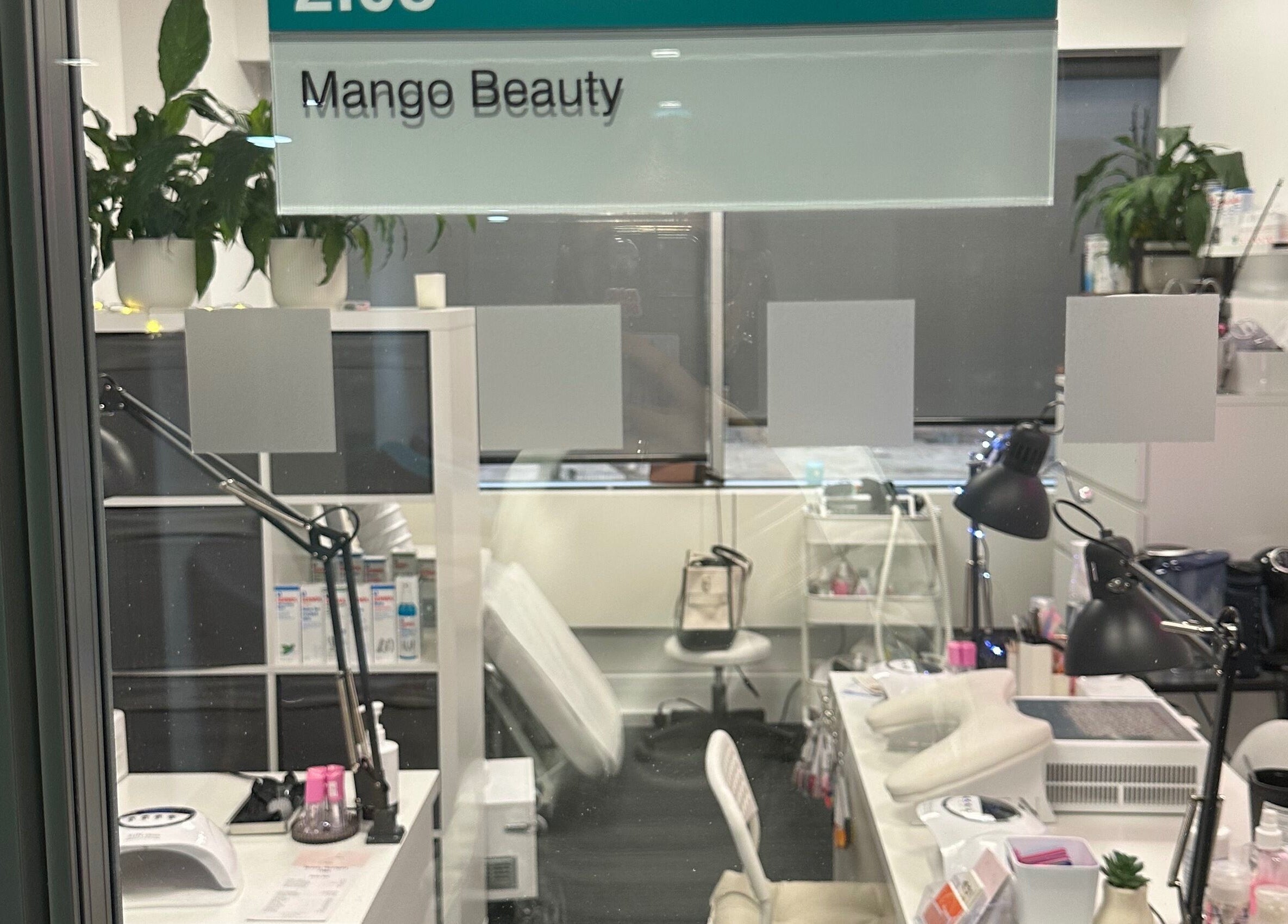 A glimpse inside Mango Beauty Studio, Woking, England, GB showcasing chic decor and professional setup.