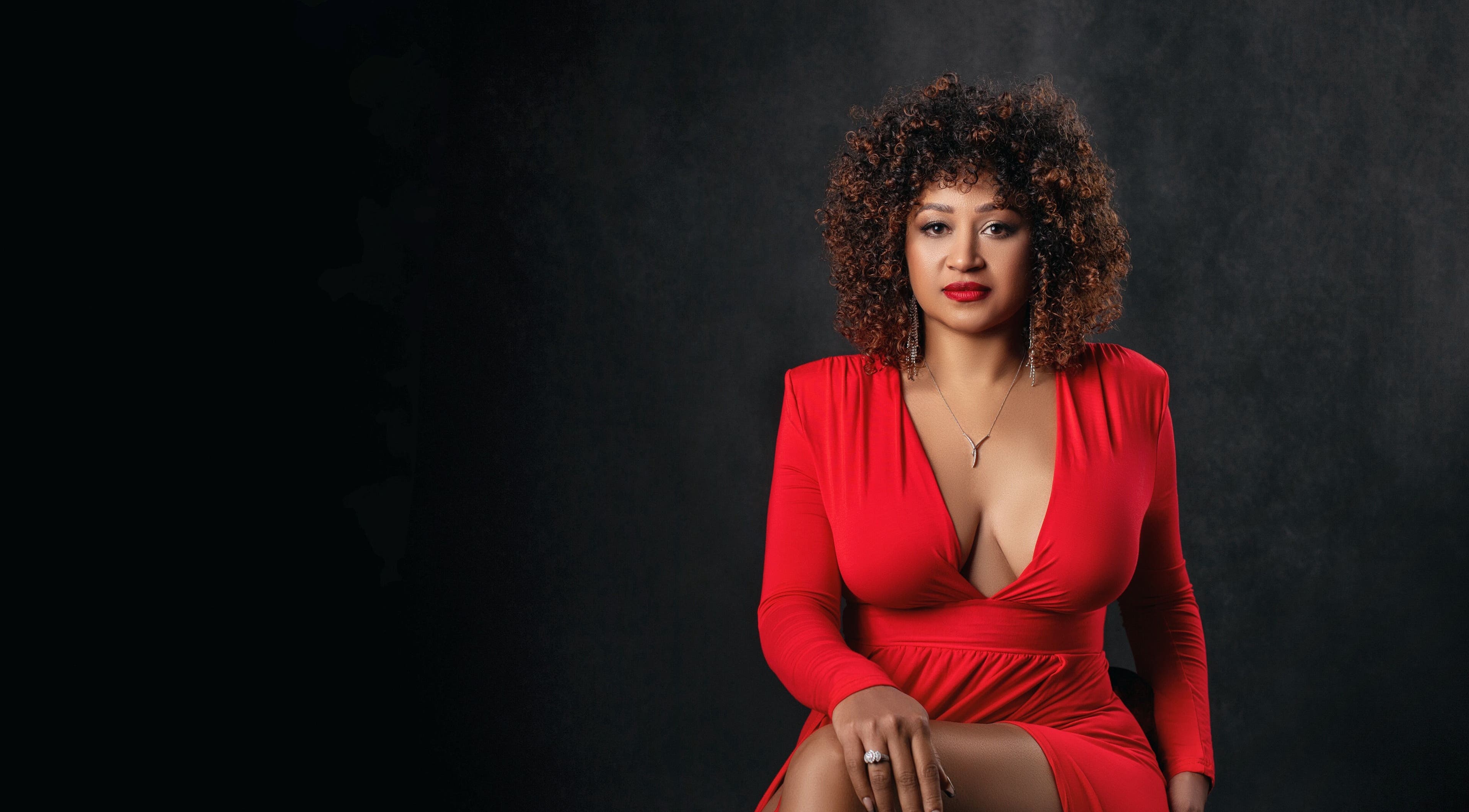 Stylish woman in a red dress at Kisairy Nails, Silver Spring, Maryland, US.