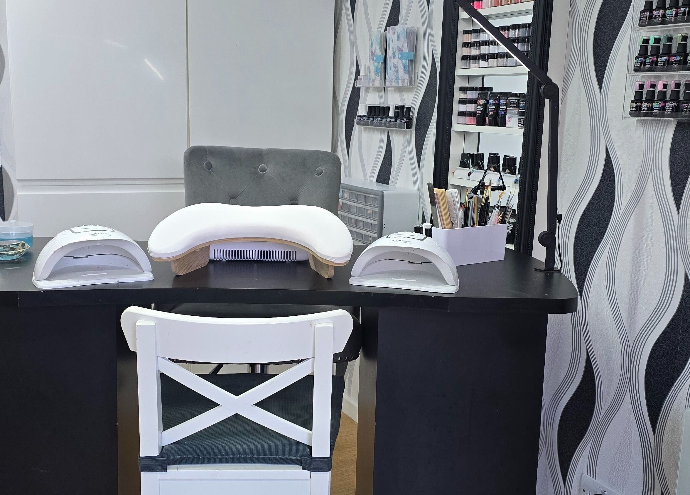 Modern nail station at Contrast Lashes and Nails, Countesthorpe, England, GB with stylish decor and equipment.