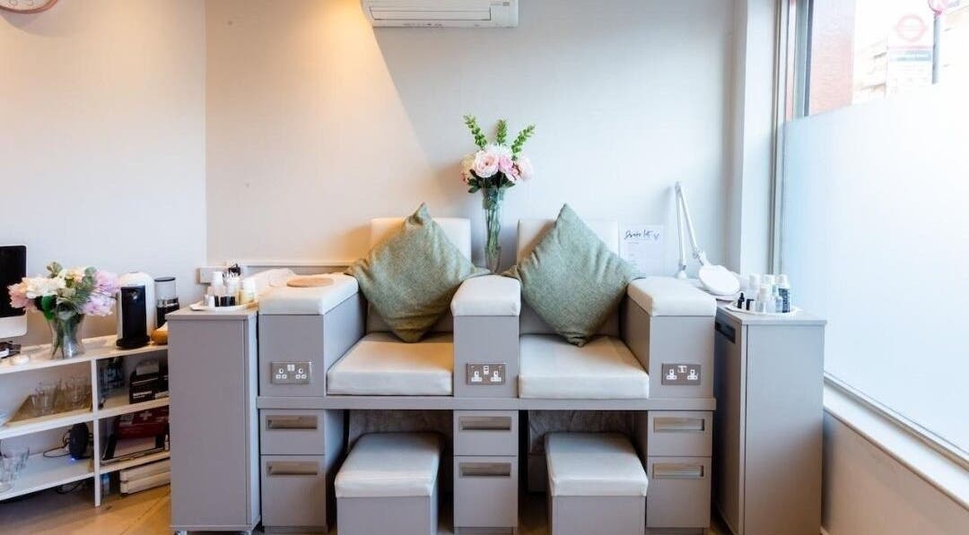 Relax in style at Enhance Angel Hair & Beauty in London, England, GB with plush salon seating and elegant decor.