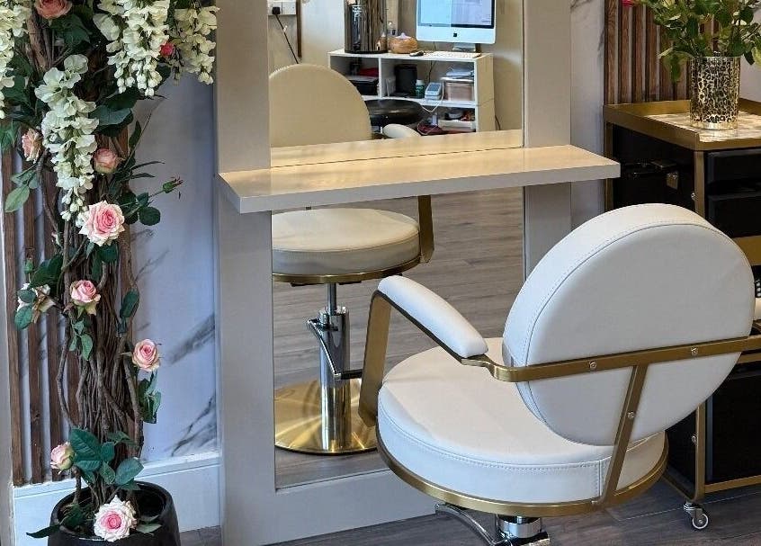 Chic salon chair and floral decor at Enhance Angel Hair & Beauty, London, England, GB.