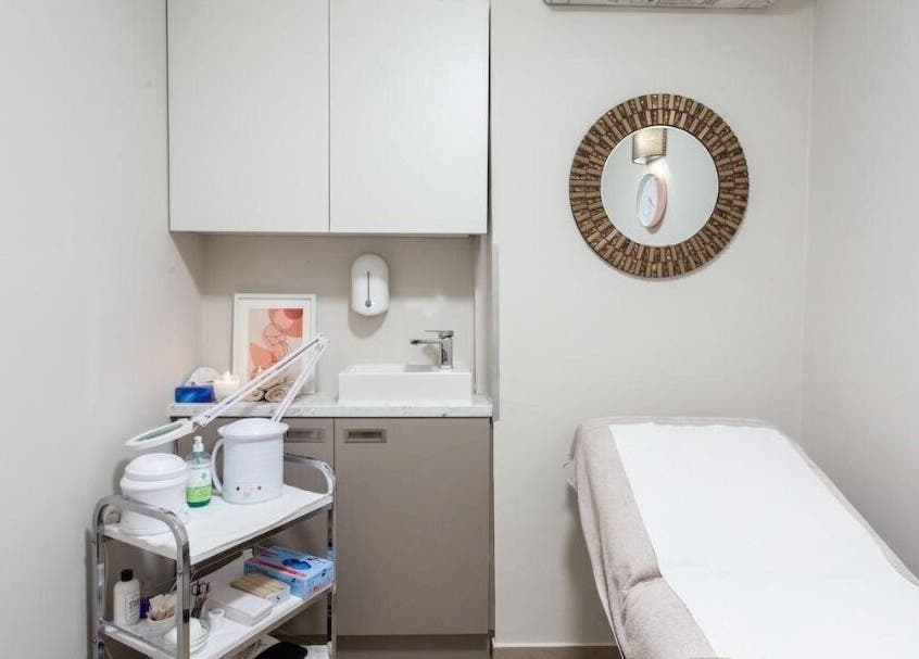 Relaxing treatment room at Enhance Angel Hair & Beauty, London, England, GB, featuring serene decor and amenities.