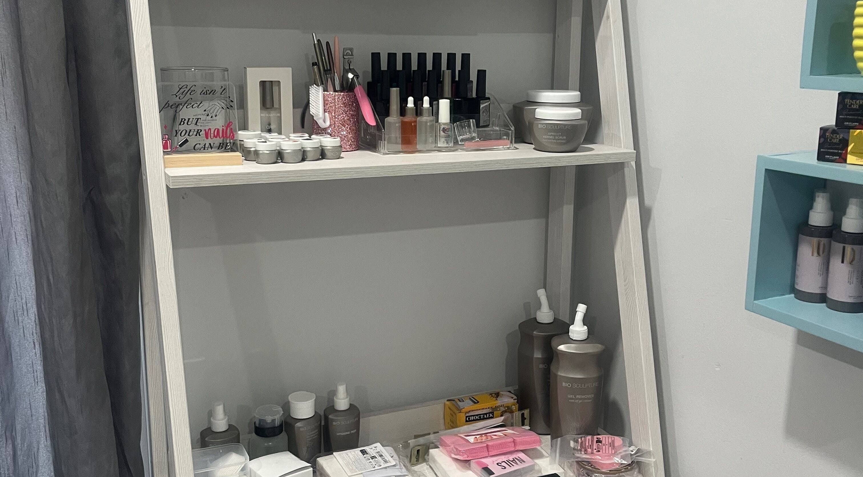 Nail care products neatly displayed on a shelf at Lau Mel Beauty, Benoni, Gauteng, ZA.