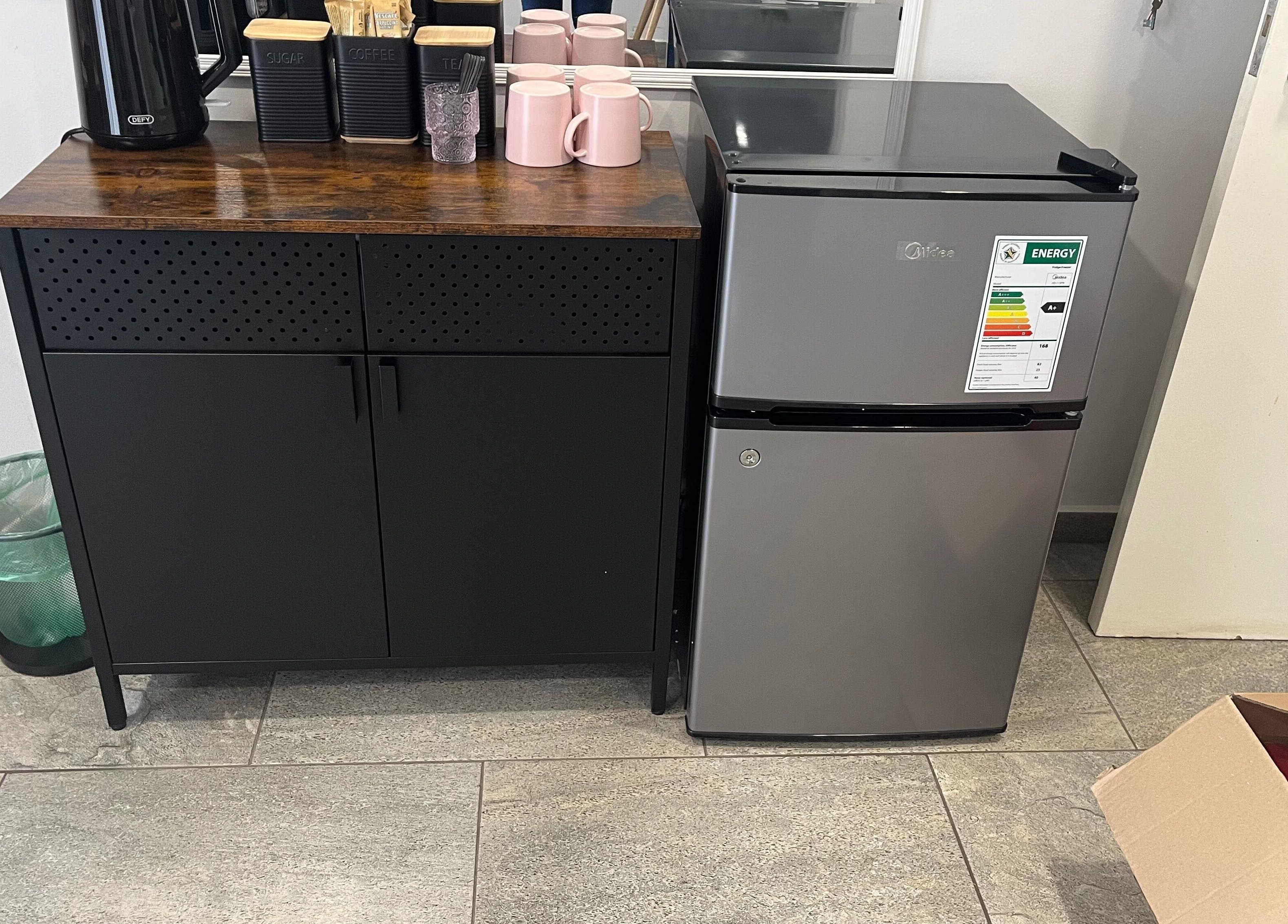 Coffee station and mini fridge at Lau Mel Beauty, Benoni, Gauteng, ZA offering refreshments for guests.