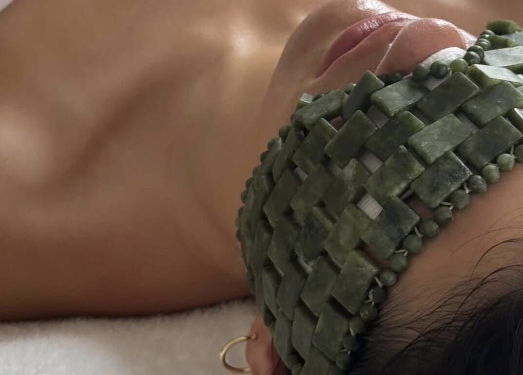 Jade mask therapy at Surya Skin + Wellness, Reigate, England, GB, offering rejuvenating spa treatments.