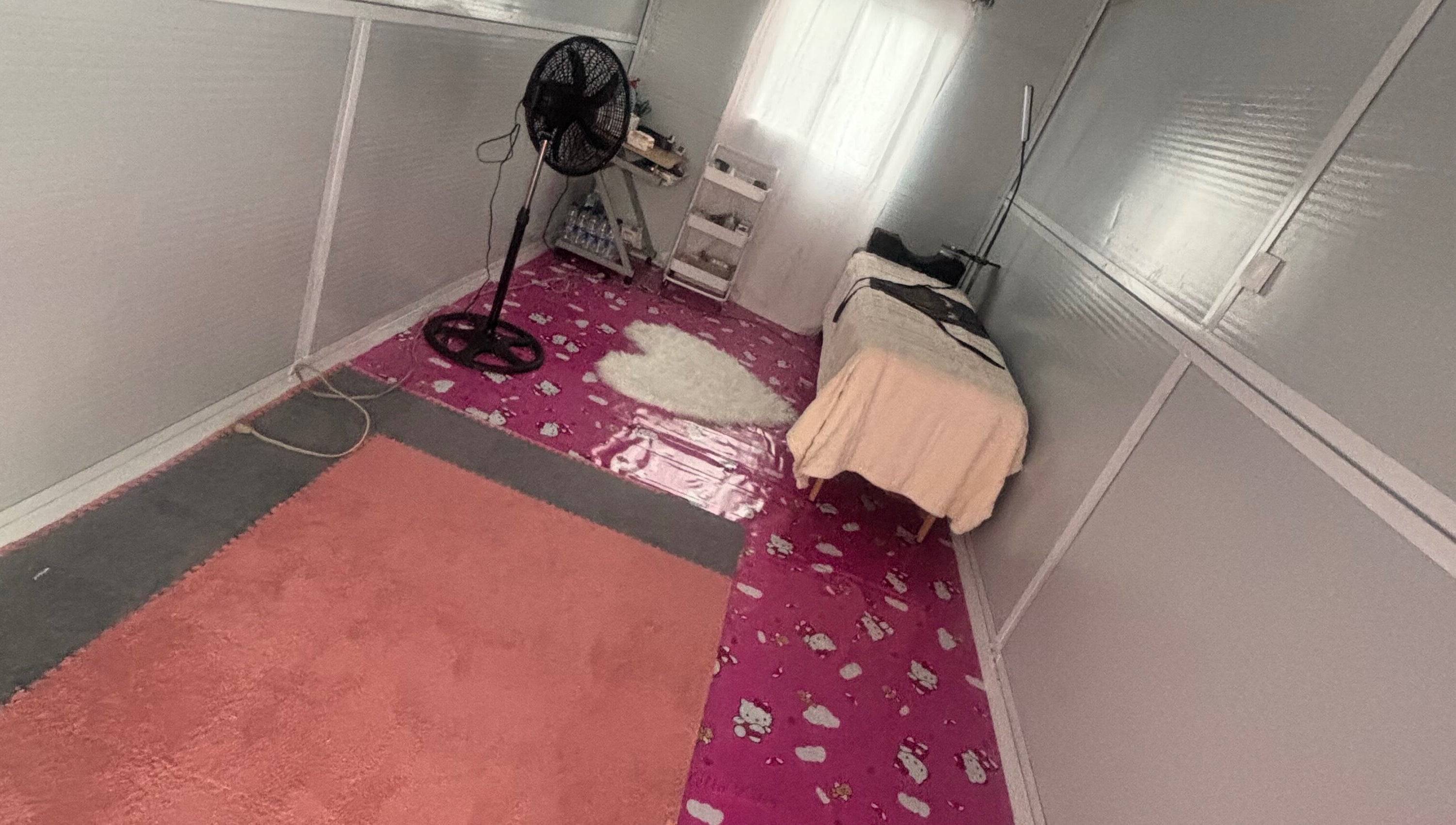 Serene treatment room at The Beauty Lab GY, Diamond, GY, featuring a bed and a calming ambiance.