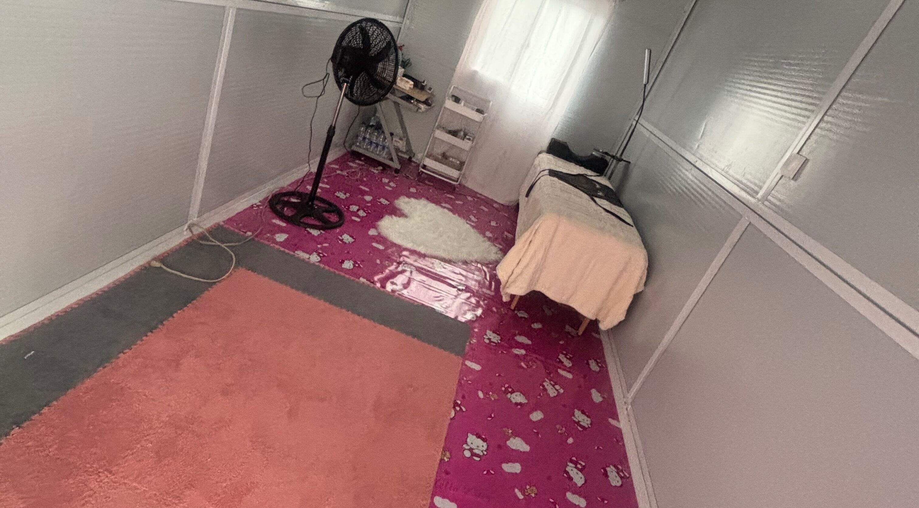 Serene treatment room at The Beauty Lab GY, Diamond, GY, featuring a bed and a calming ambiance.