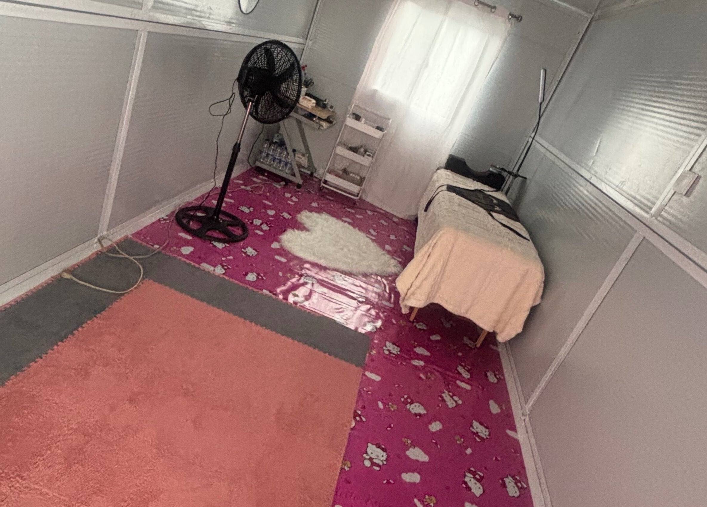 Relaxing spa treatment room at The Beauty Lab GY, Diamond, GY with cozy decor and massage table.