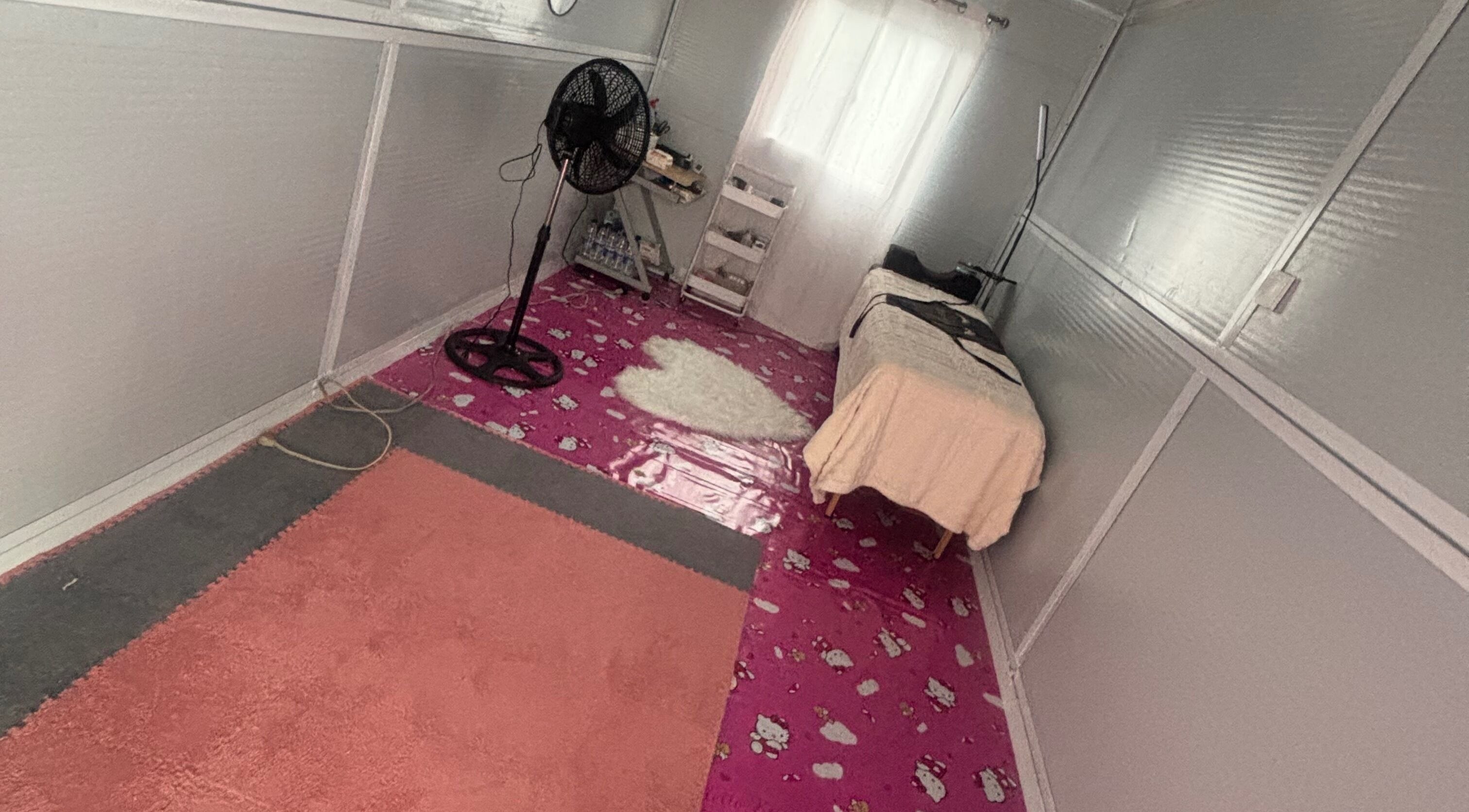 Relaxing spa treatment room at The Beauty Lab GY, Diamond, GY with cozy decor and massage table.