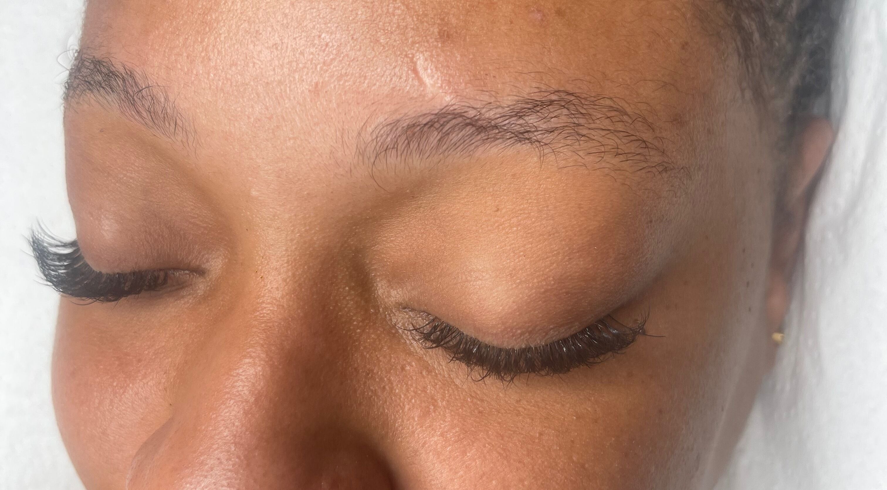 Close-up of expertly applied eyelash extensions at Shari Beauty Studio in Portmore, St. Catherine Parish, JM.