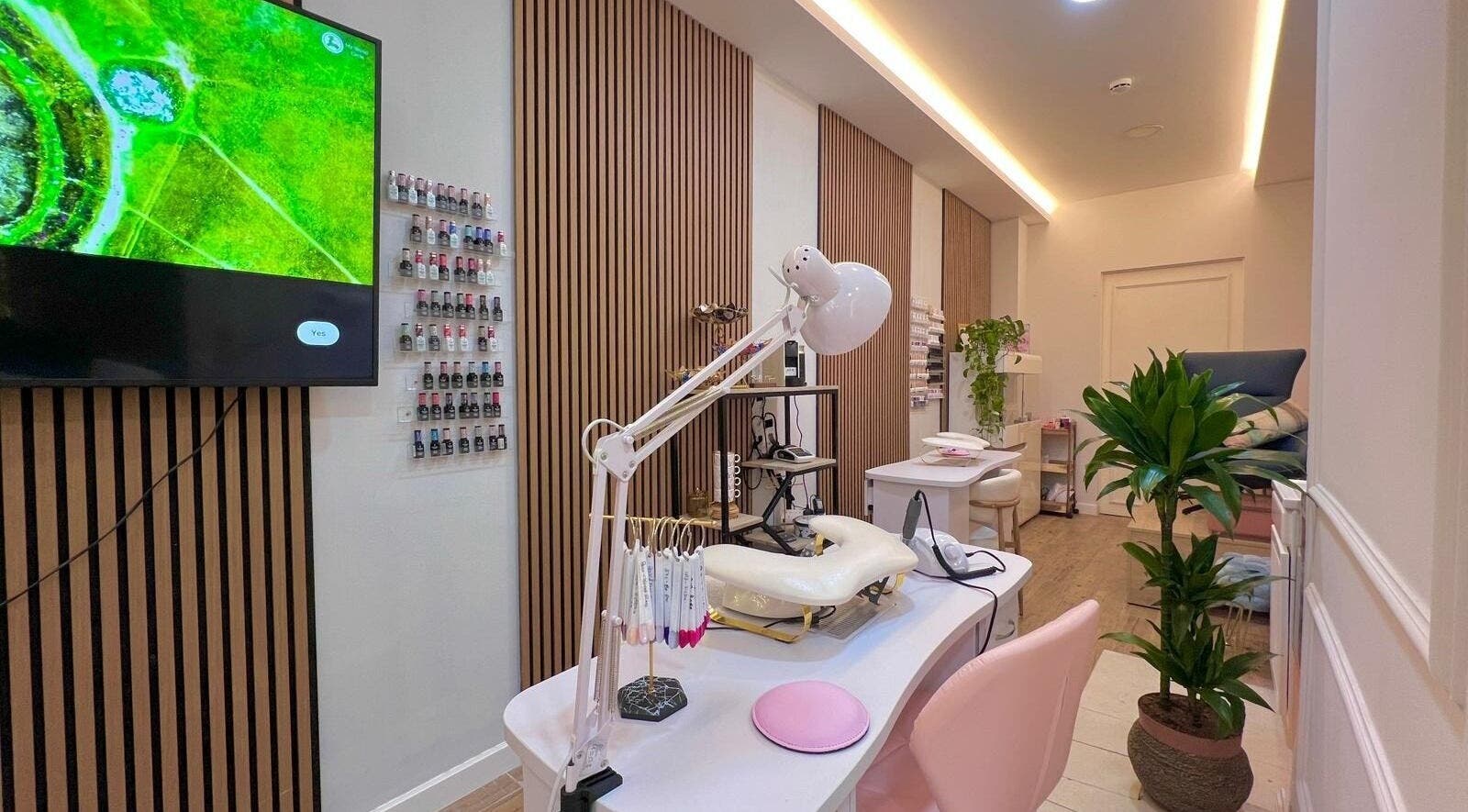 Stylish interior of Bluma Nail Bar, Tas-sliema, MT with nail polish display and modern decor.