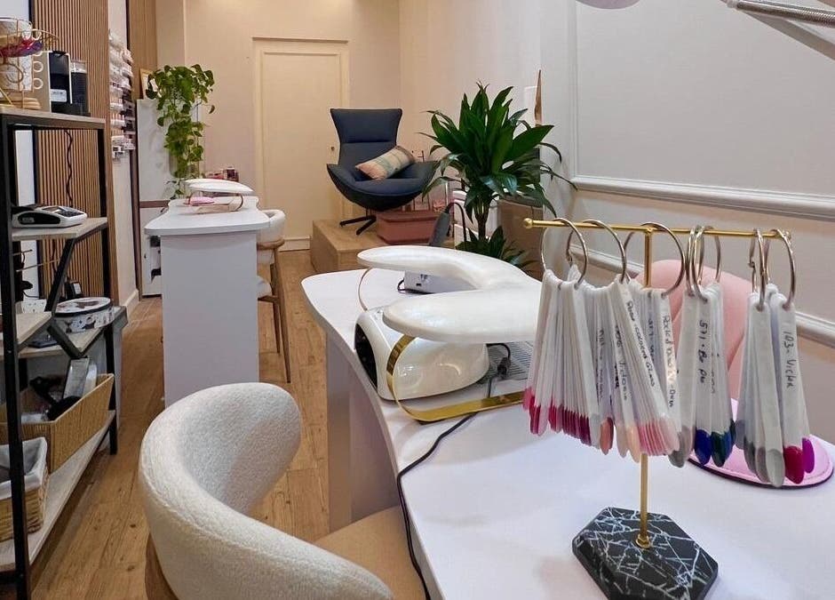 Elegant interior of Bluma Nail Bar in Tas-sliema, MT, showcasing modern nail art stations and cozy seating.
