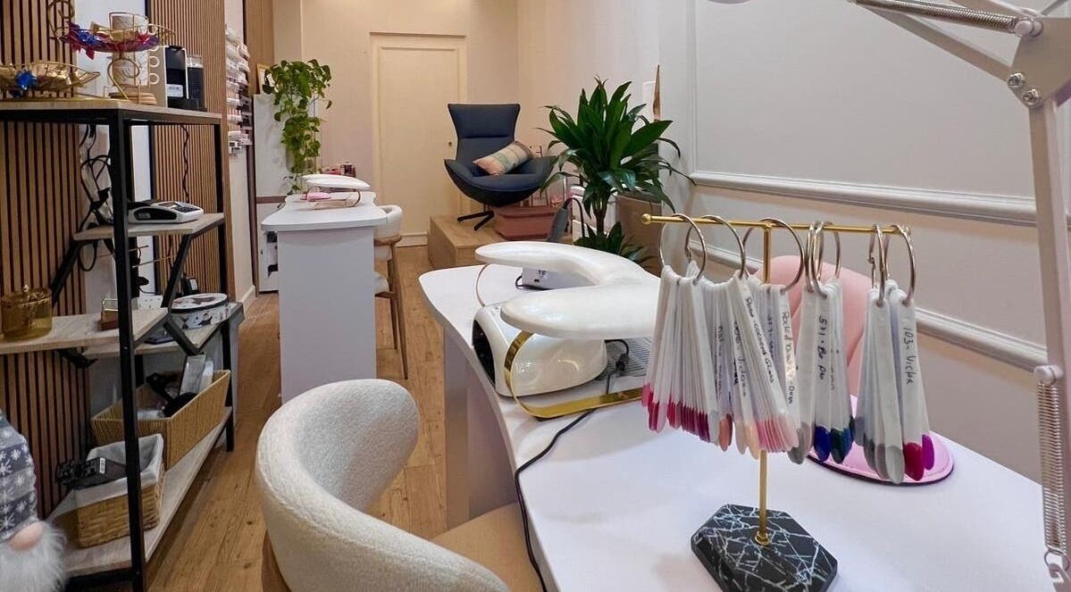 Elegant interior of Bluma Nail Bar in Tas-sliema, MT, showcasing modern nail art stations and cozy seating.