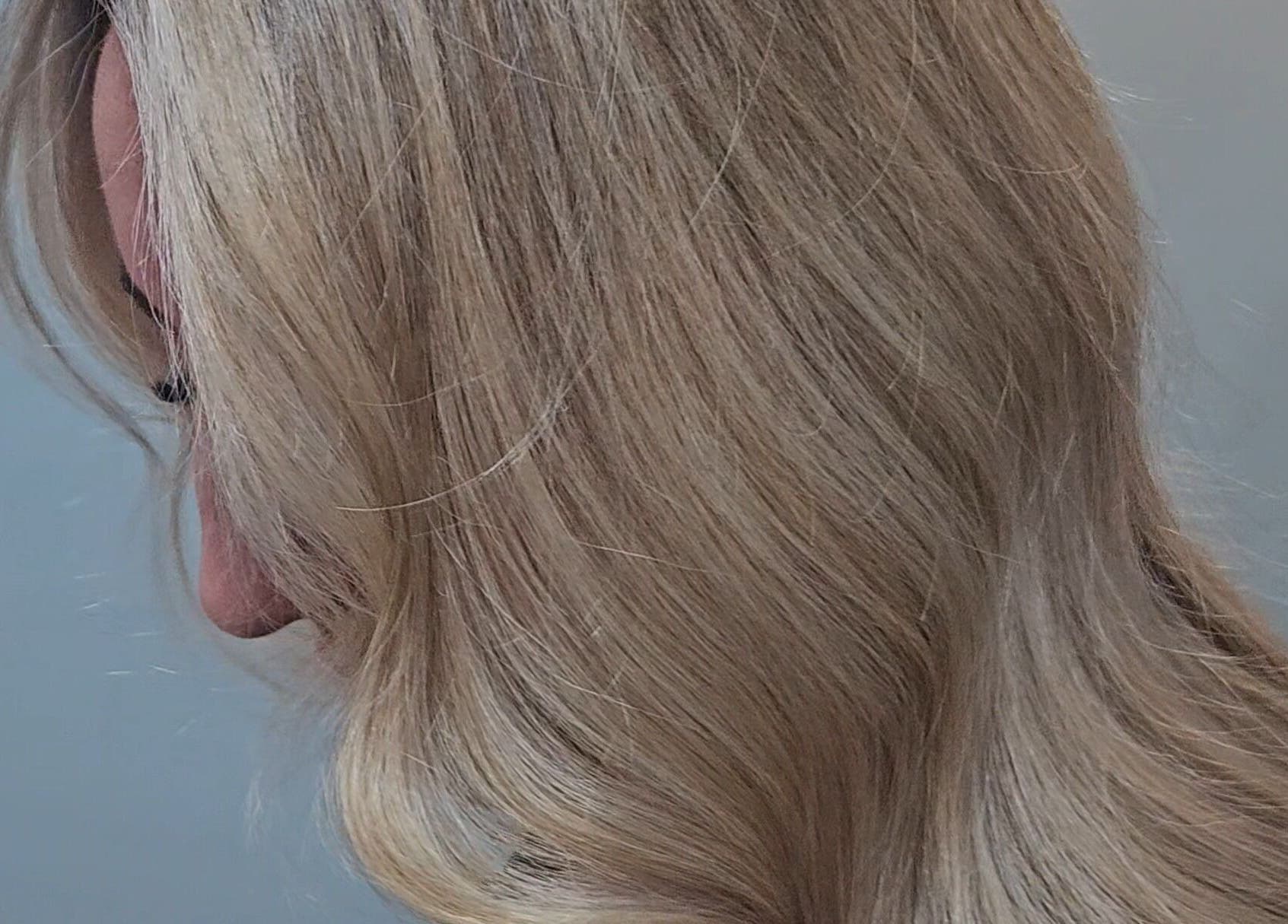 Side view of styled blonde hair at Movement not just hair, Surry Hills, New South Wales, AU.