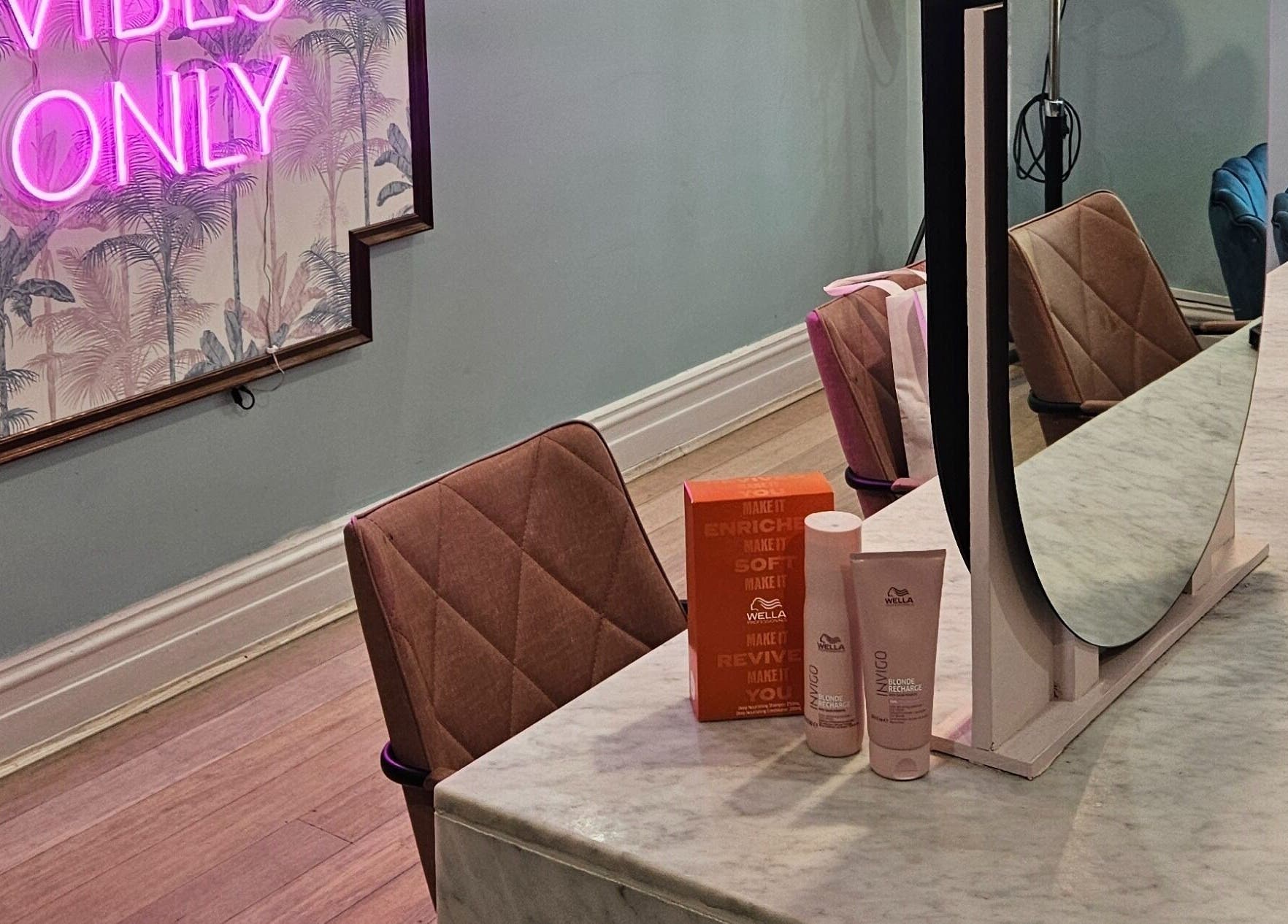 Elegant salon setup at Movement Not Just Hair in Surry Hills, New South Wales, AU, featuring a chic vanity area.