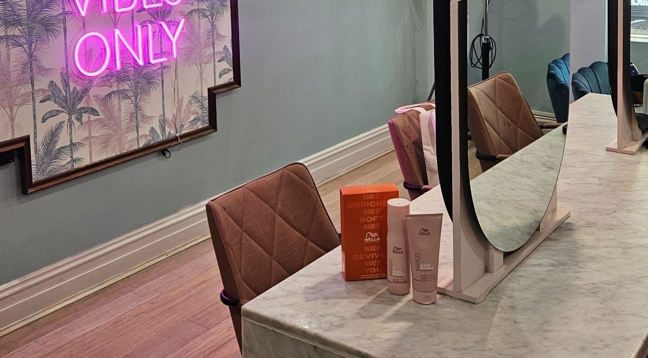 Elegant salon setup at Movement Not Just Hair in Surry Hills, New South Wales, AU, featuring a chic vanity area.