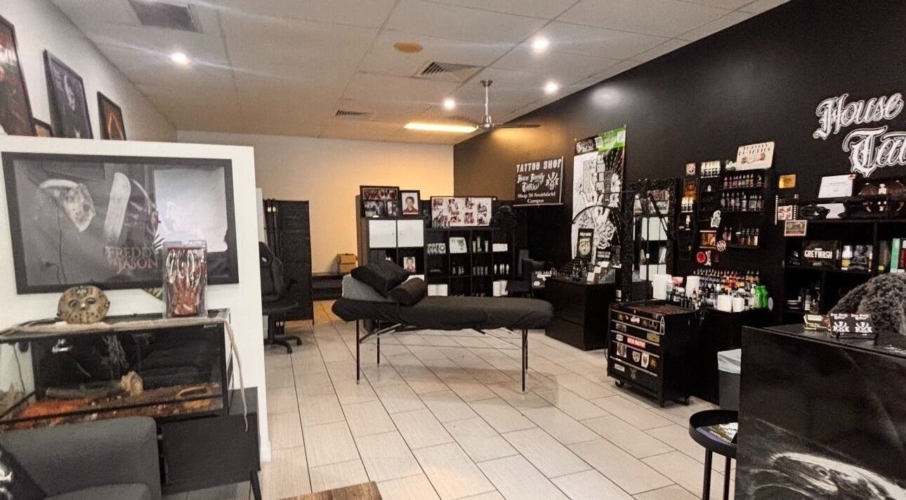 Interior of Skin&stones Body Piercing in Smithfield, Queensland, showcasing a stylish setup and artwork.