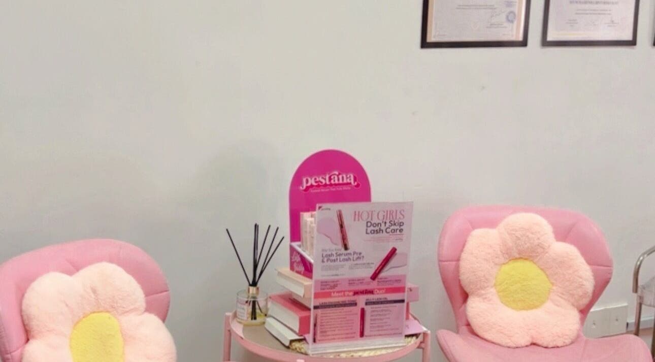 Cozy pink chairs with floral cushions at Ruang Spa Azren, Kuala Lumpur, Wilayah Persekutuan Kuala Lumpur, MY.