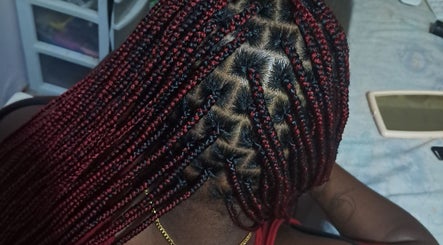Detailed red and black braids by Styled By Dee 268 in Saint John's, Saint John, AG.