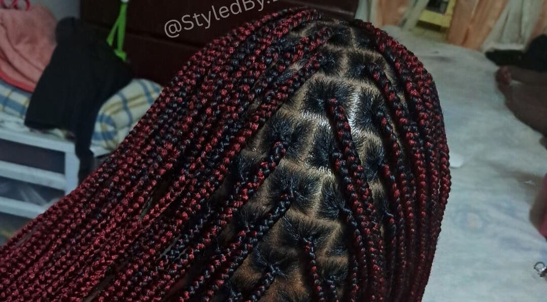 Intricate red and black braids at Styled By Dee 268, Saint John's, Saint John, AG.