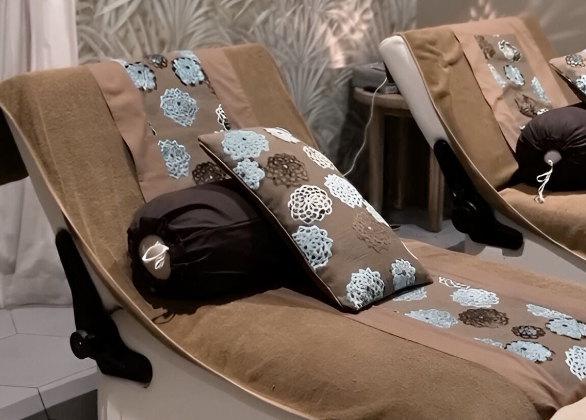 Cozy lounge chairs at Aliya Wellness Spa in Bali, Bali, ID, offering a serene and tranquil atmosphere.