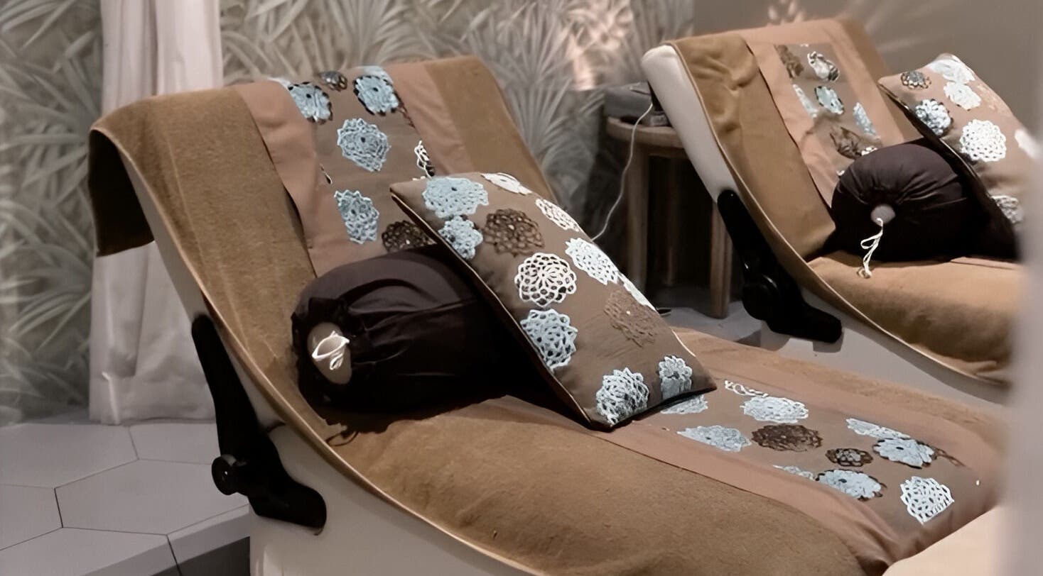 Cozy lounge chairs at Aliya Wellness Spa in Bali, Bali, ID, offering a serene and tranquil atmosphere.