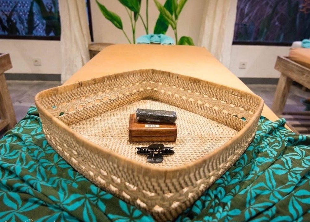 Natural woven tray at Aliya Wellness Spa, Bali, Bali, ID, enhances spa decor for a tranquil experience.