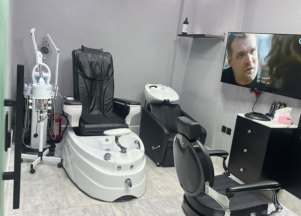 AJ barbershop in Jeddah, Makkah Province, SA showcases a modern grooming chair and equipment.