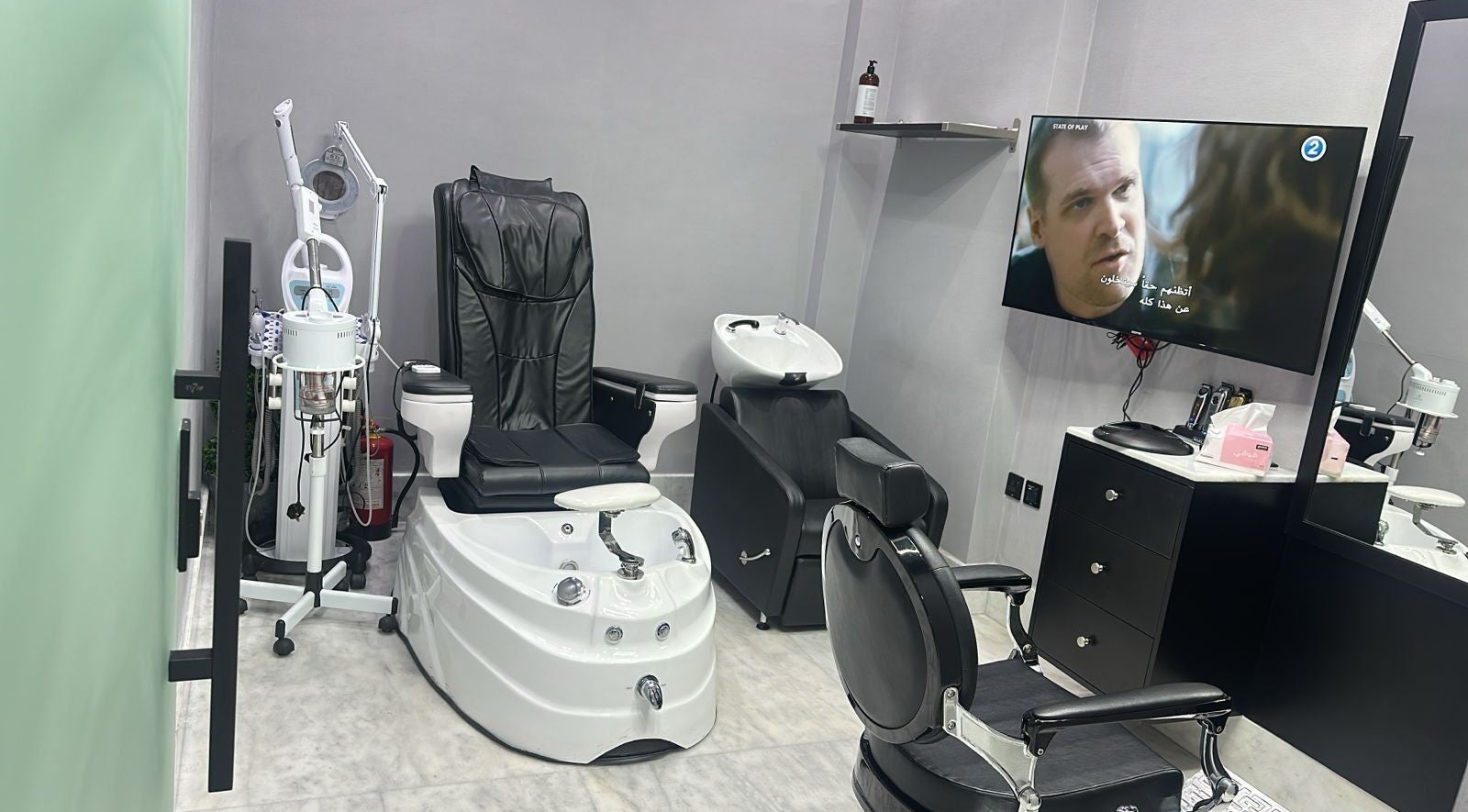 AJ barbershop in Jeddah, Makkah Province, SA showcases a modern grooming chair and equipment.