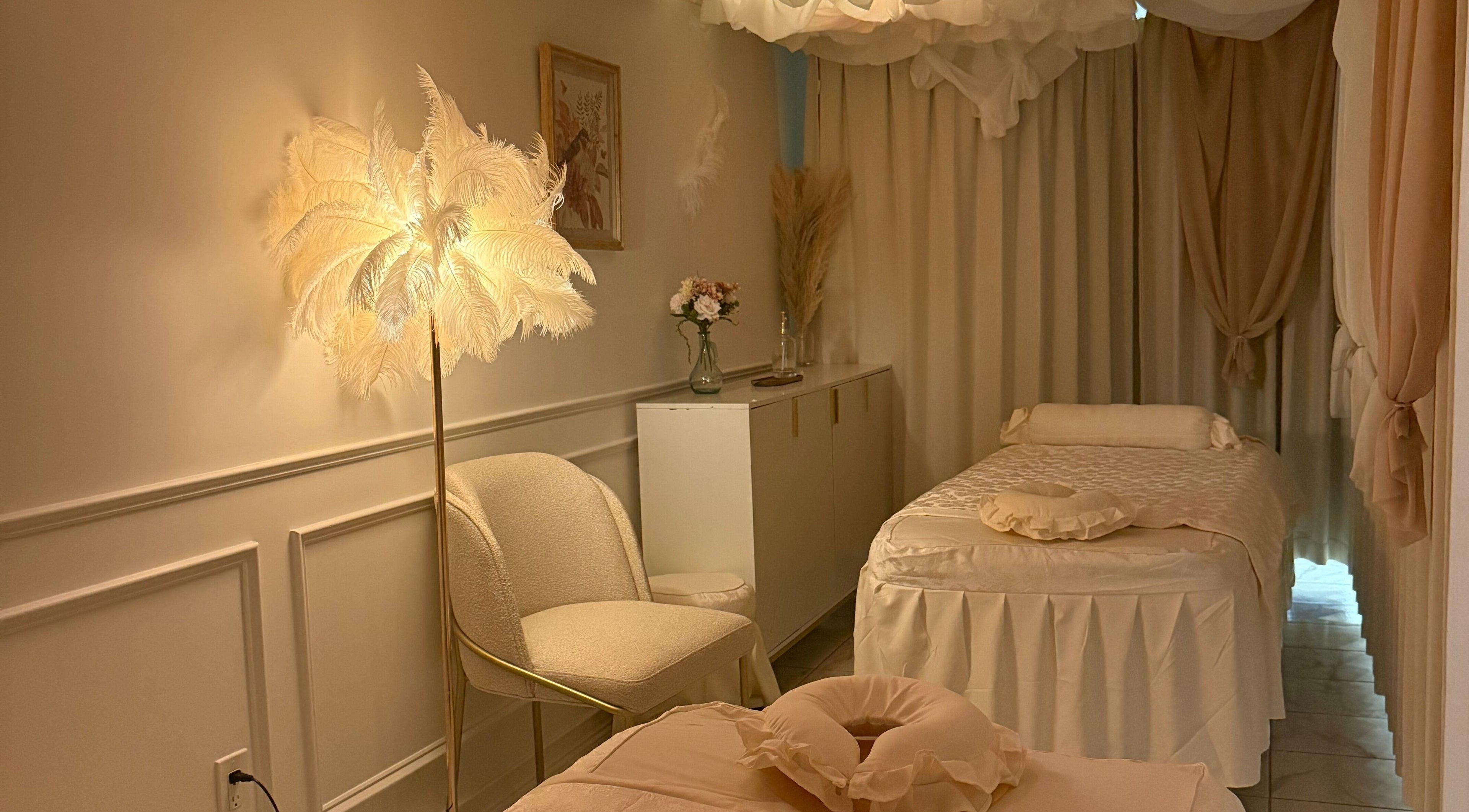 Relaxing treatment room at Bayside Day Spa, New York, New York, US with soft lighting and elegant decor.