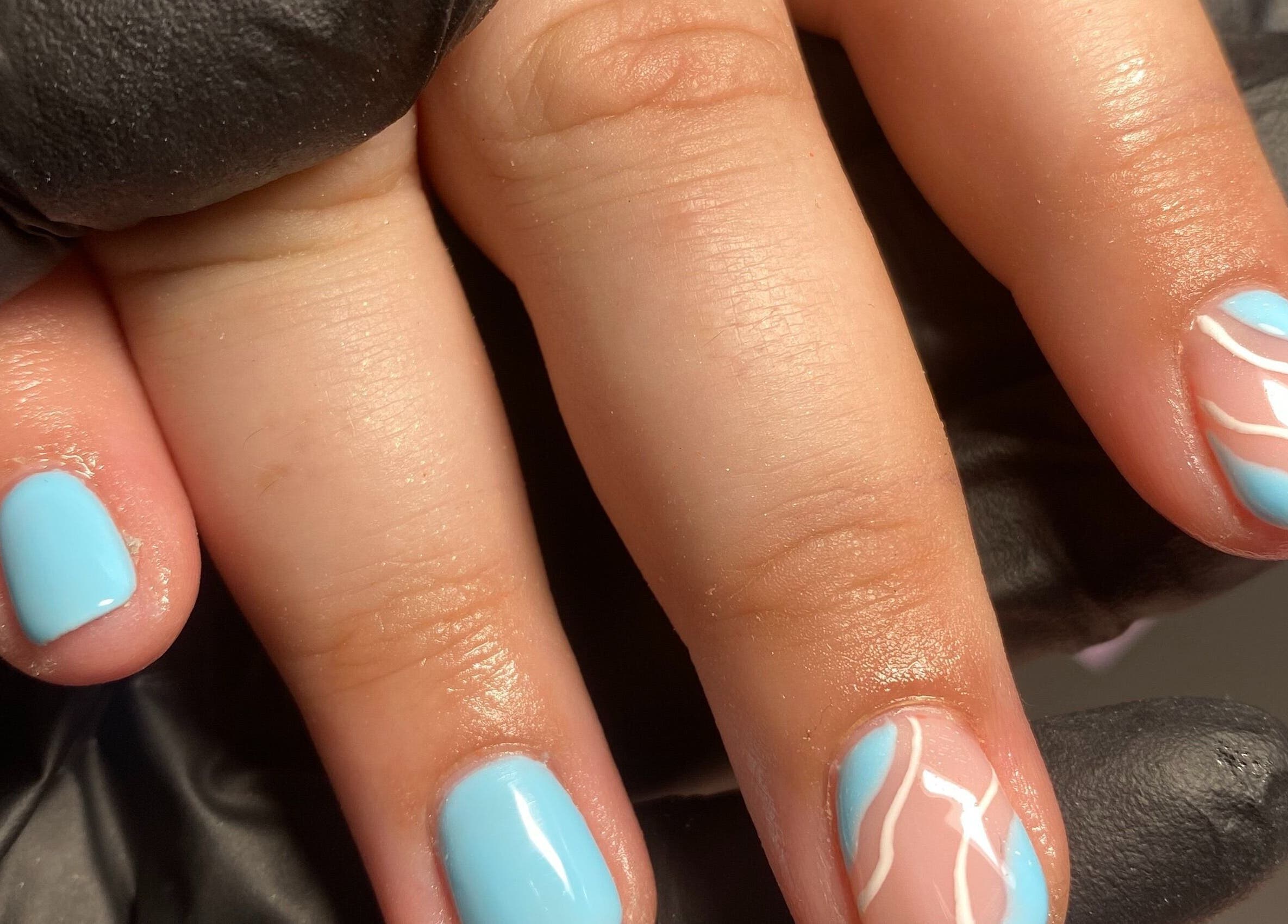 Stylish aqua nails with white accents at Nails by Cee, Crofton, England, GB.