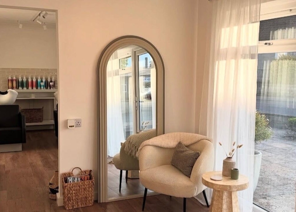Cozy salon interior at Styled By Soph, Somerton, England, GB with soft lighting and stylish decor.