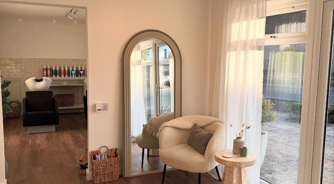 Cozy salon interior at Styled By Soph, Somerton, England, GB with soft lighting and stylish decor.