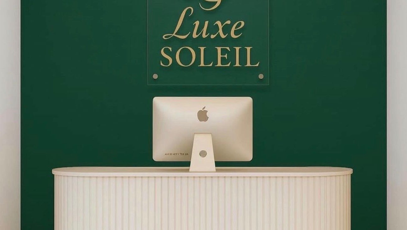 Reception desk at Luxe Soleil in Yagoona, New South Wales, AU, showcasing a sleek and modern design.