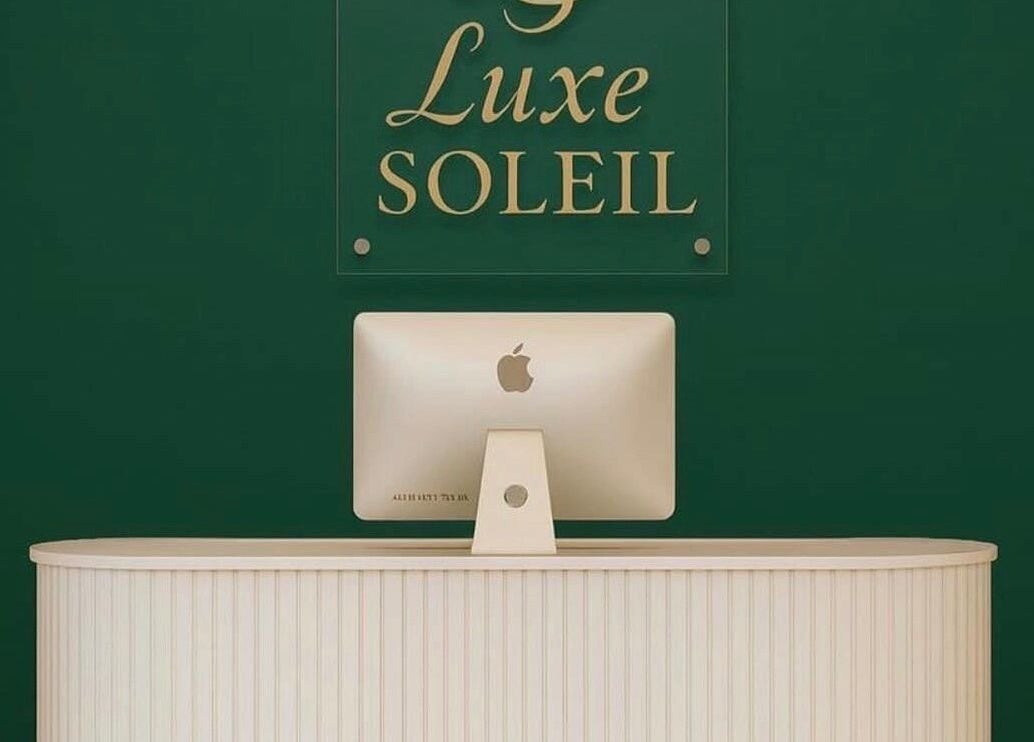 Reception desk at Luxe Soleil in Yagoona, New South Wales, AU, showcasing a sleek and modern design.