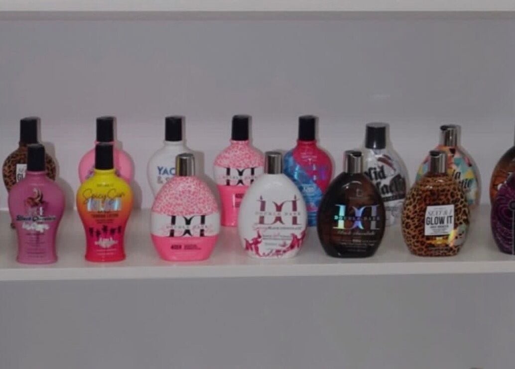 Luxe Soleil's vibrant tanning lotion selection in Yagoona, New South Wales, AU, displayed on a shelf.