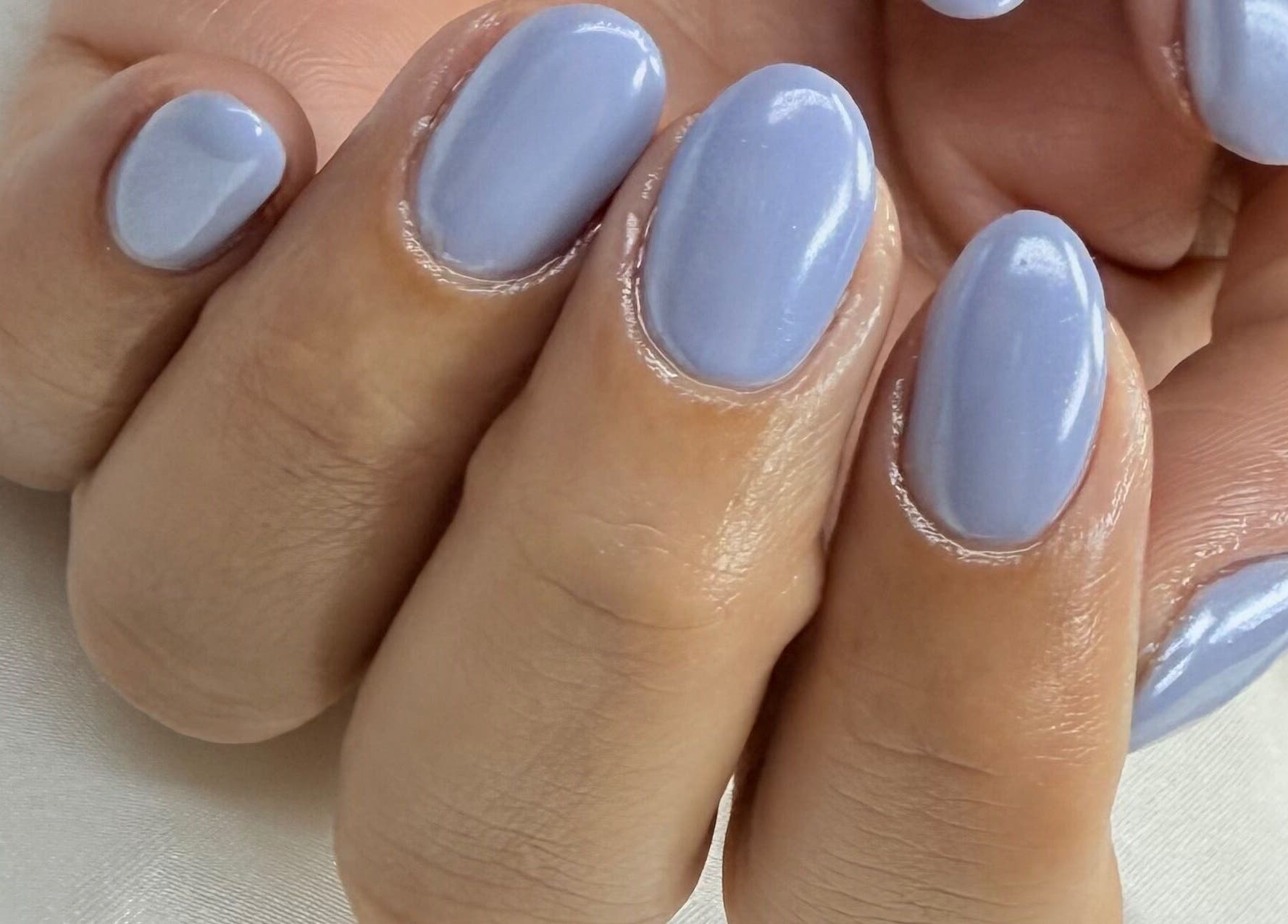 Fresh lavender manicure at Prontinha Beauty, Dublin, County Dublin, IE, showcasing glossy perfection.